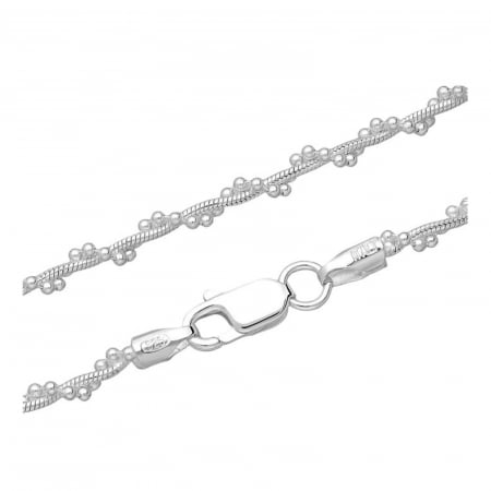 Silver chain at the base of the neck with spheres