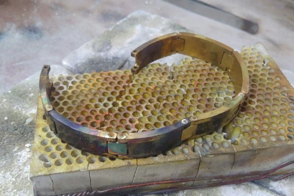 large gold bracelet being created