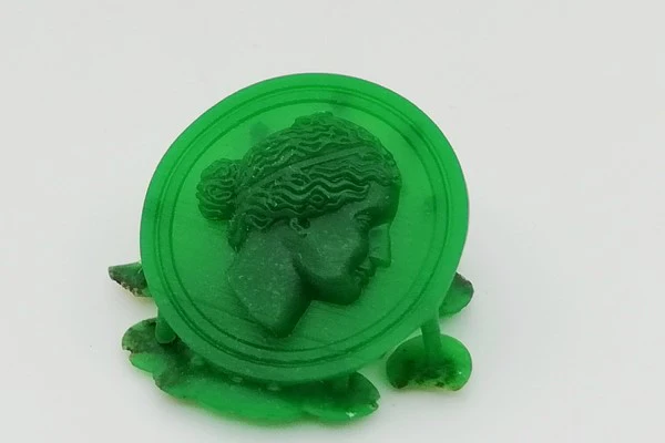 Medal with Greek face model in wax