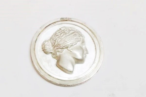 view of the medal with photographic engraving in relief
