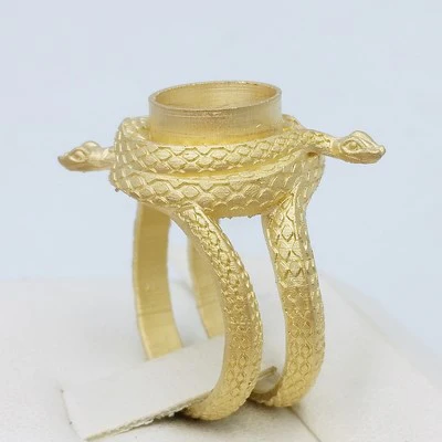 gold snake signet ring in the making