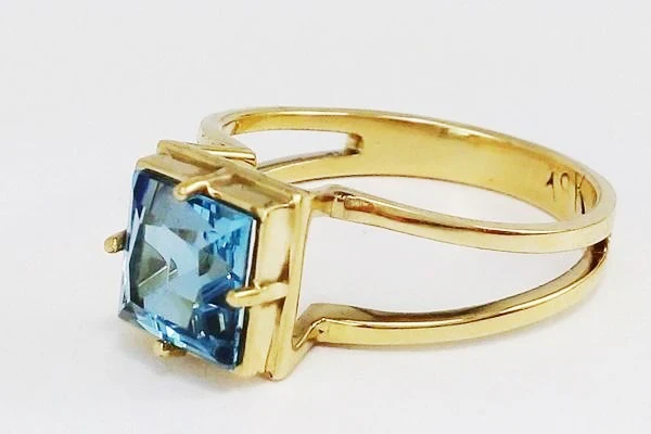 gold ring with blue topaz