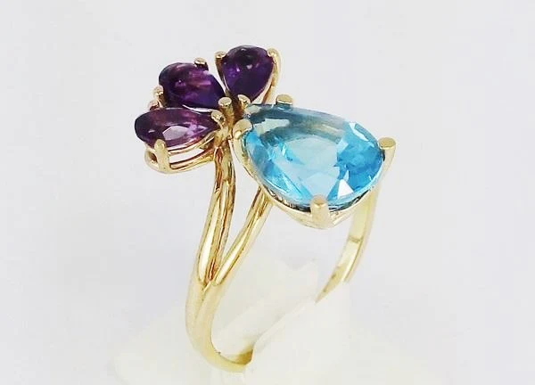 gold engagement ring with topaz stone and 3 amethyst stones