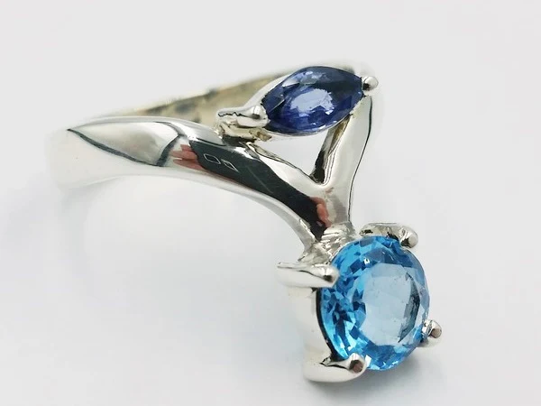 white gold ring with blue topaz