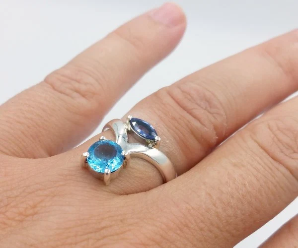 ring with blue topaz worn on the finger