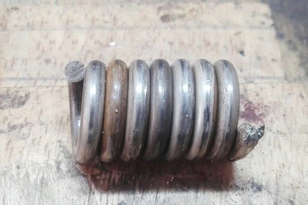 spiral of silver wire to make bracelet links