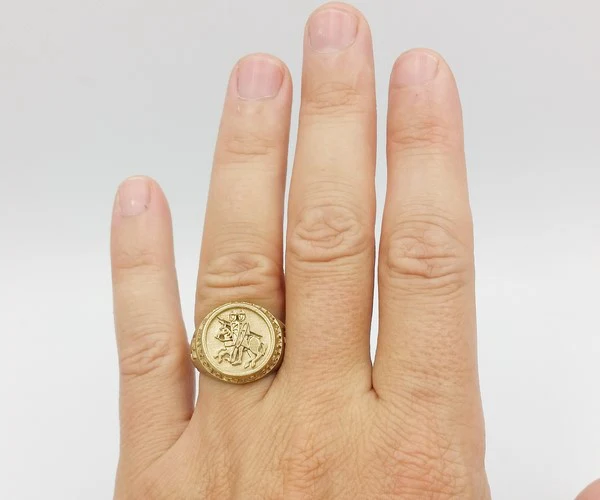 Gold Templar signet ring worn on the ring finger